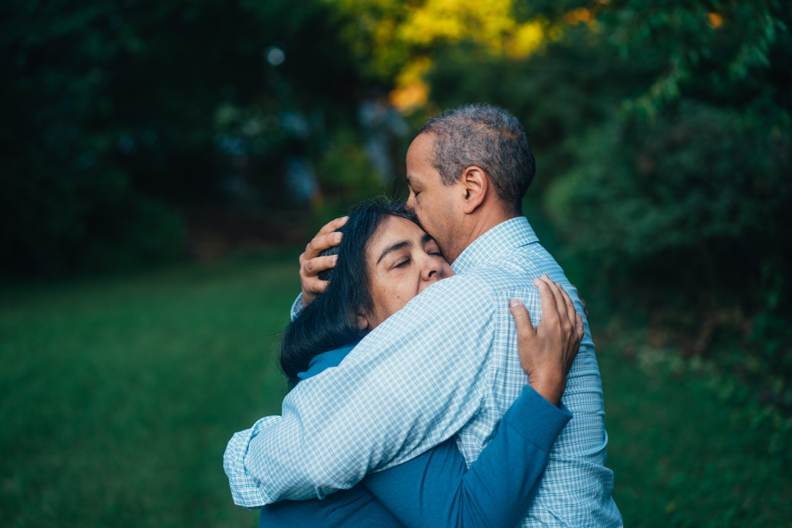 Man hugging woman