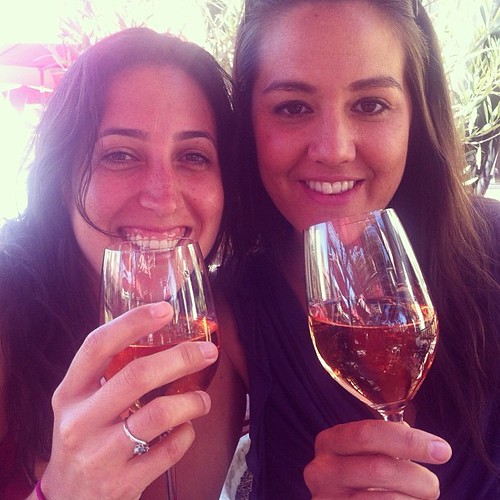 two women drinking rose